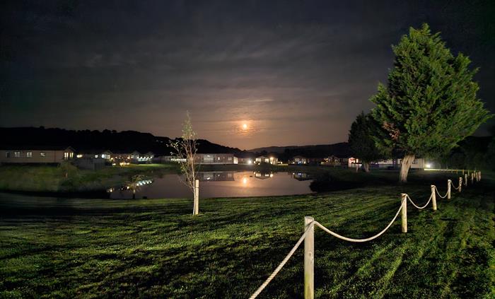 The lakeside lodges on a moonlit night